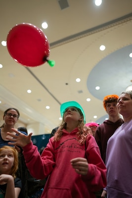 Students fly balloons attached to 3-D rocket boosters to demonstrate Newton's Third Law of Motion during the Sea-Air-Space Science, Technology, Engineering, and Math (STEM) expo at the Gaylord National Hotel and Conference Center, Sunday. The activity was hosted by the U.S. Navy's Strategic Systems Programs (SSP) to connect young learners' proficiencies in STEM activities to elements of the real-world missions of commands like SSP.  SSP is the Navy command that is responsible for the cradle-to-grave lifecycle of the submarine-launched ballistic missile system.