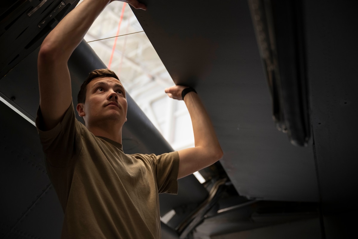 Staff Sgt. Jacob Alvarado, 22nd Maintenance Squadron repair and reclamation journeyman, poses for a photo at McConnell Air Force Base, Kansas, March 12, 2024. Alvarado was a part of a volunteer team to fix 'Doc', a B-29 bomber. (U.S. Air Force photo by Airman Paula Arce)