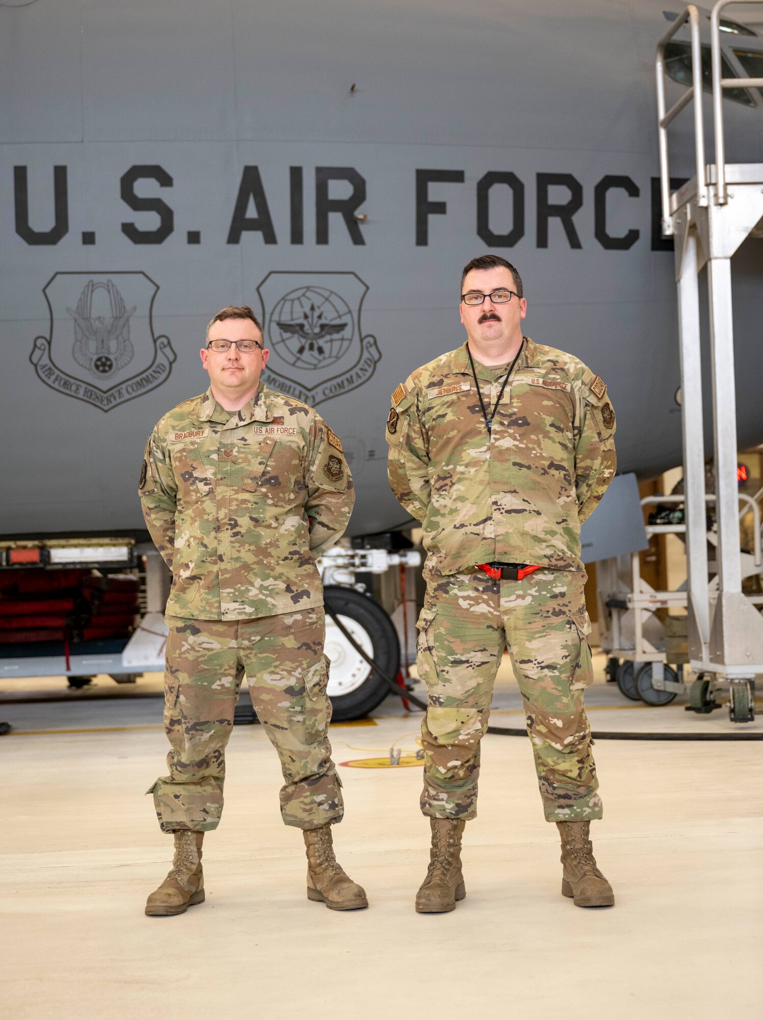 Tech. Sgt. Gene Bradbury, 22nd Maintenance Squadron repair and reclamation section chief, Master Sgt. Kenneth Jenkins, 22nd MXS maintenance flight chief, pose for a photo at McConnell Air Force Base, Kansas, March 12, 2024. Bradbury and Jenkins led a team of volunteer Airmen to fix 'Doc', a B-29 bomber. (U.S. Air Force photo by Airman Paula Arce)