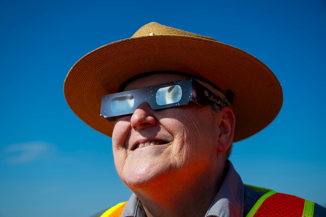 A total solar eclipse shines in the sky viewed from the Michael J. Kirwan Dam in Ravenna, Ohio, April 8, 2024.