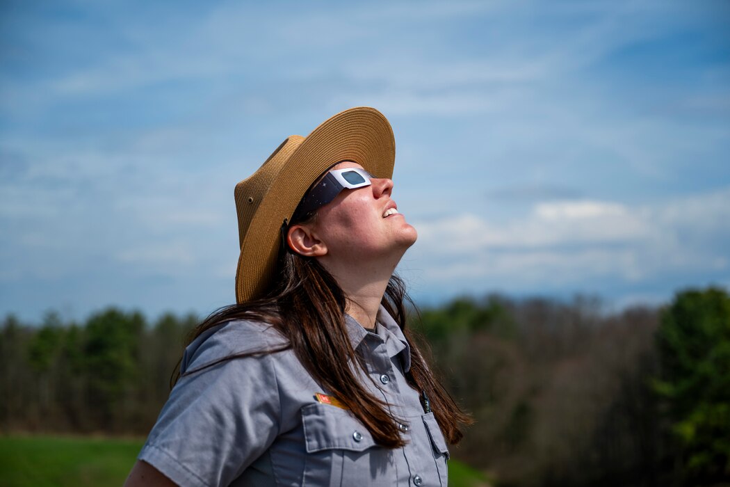 A total solar eclipse shines in the sky viewed from the Michael J. Kirwan Dam in Ravenna, Ohio, April 8, 2024.