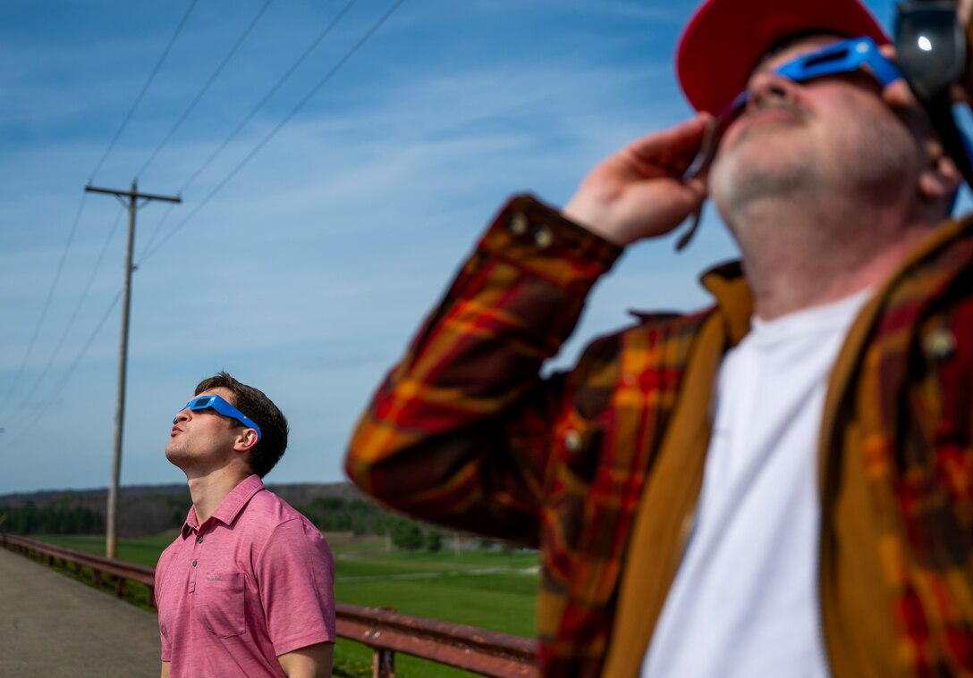 A total solar eclipse shines in the sky viewed from the Michael J. Kirwan Dam in Ravenna, Ohio, April 8, 2024.