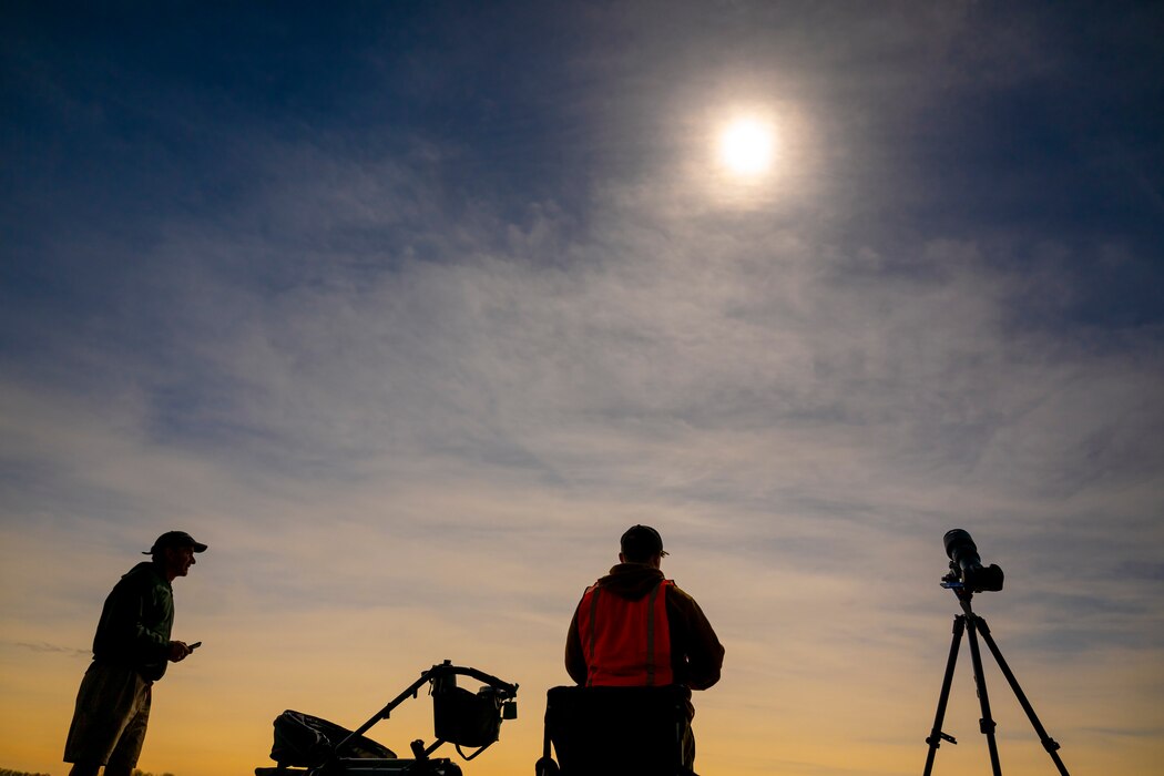 A total solar eclipse shines in the sky viewed from the Michael J. Kirwan Dam in Ravenna, Ohio, April 8, 2024.