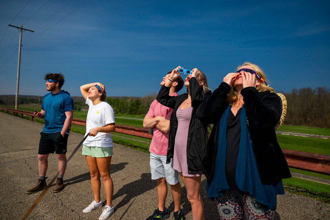 A total solar eclipse shines in the sky viewed from the Michael J. Kirwan Dam in Ravenna, Ohio, April 8, 2024.