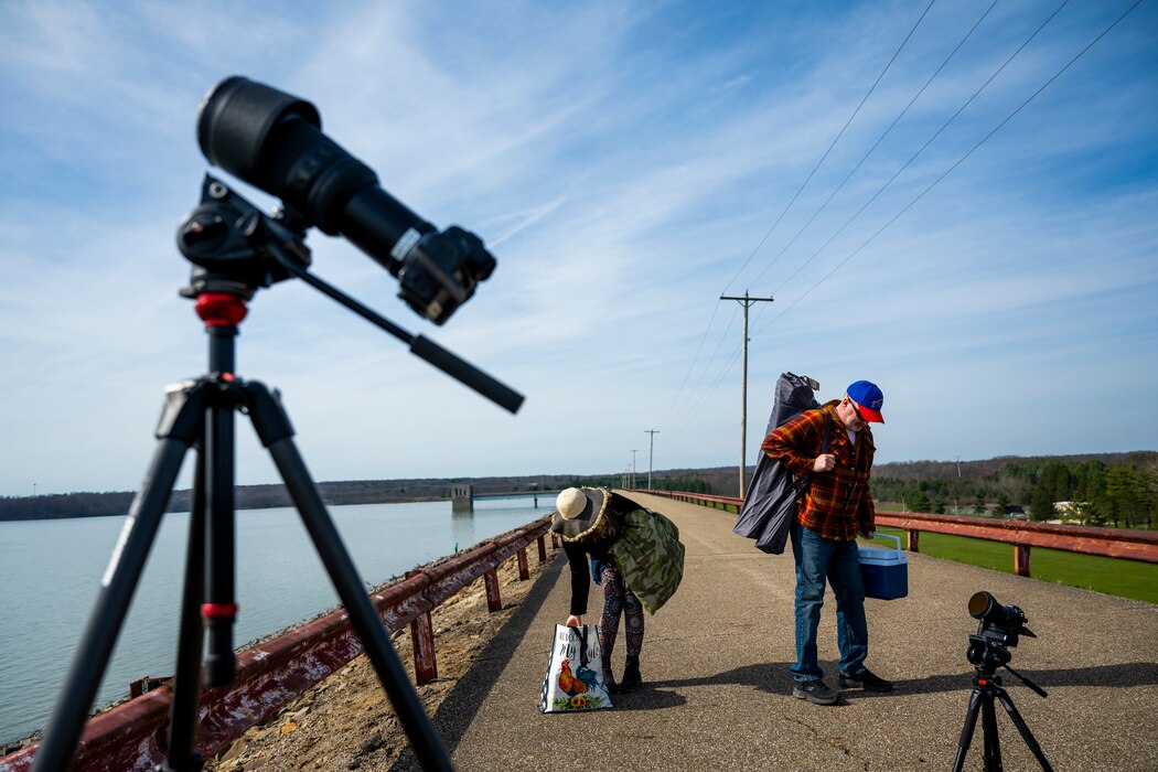 A total solar eclipse shines in the sky viewed from the Michael J. Kirwan Dam in Ravenna, Ohio, April 8, 2024.