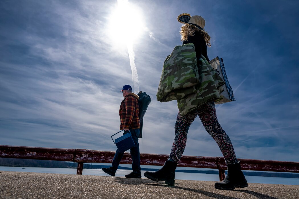 A total solar eclipse shines in the sky viewed from the Michael J. Kirwan Dam in Ravenna, Ohio, April 8, 2024.