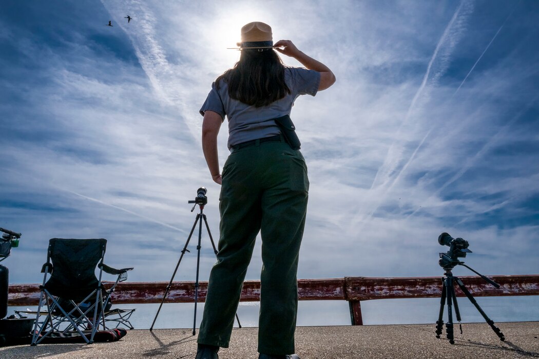 A total solar eclipse shines in the sky viewed from the Michael J. Kirwan Dam in Ravenna, Ohio, April 8, 2024.