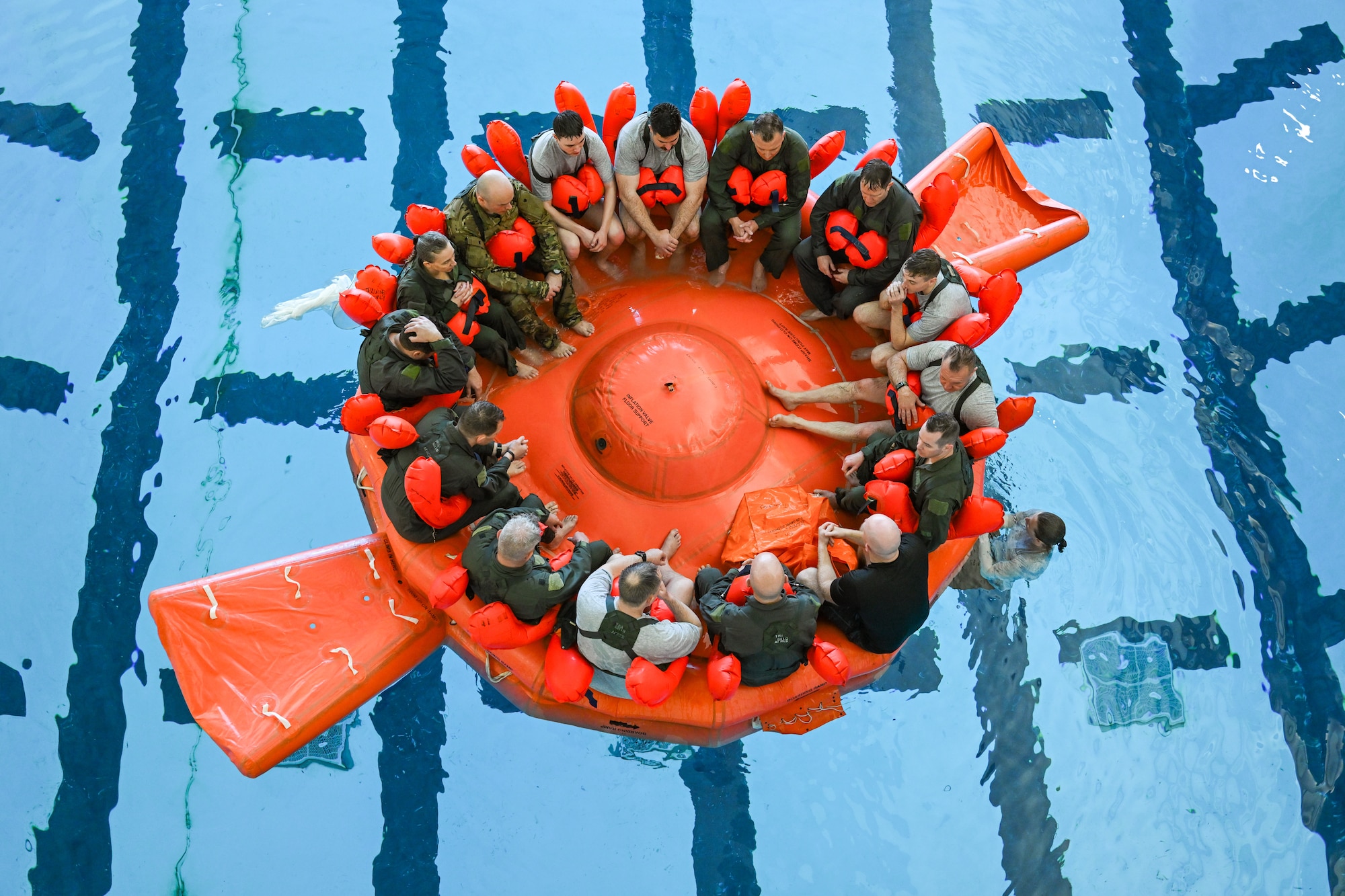 Reserve Citizen Airmen assigned to the 910th Operations Group float in a 20-person life raft during water survival training on April 7, 2024, at Youngstown State University, Ohio.