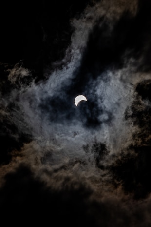 The moon begins its eclipse over the sun at Marine Corps Recruit Depot San Diego, California, April 8, 2024. The MCRD San Diego Library held a watch party for service members and their families to observe the eclipse. (U.S. Marine Corps photo Sgt. Jesse K. Carter-Powell)