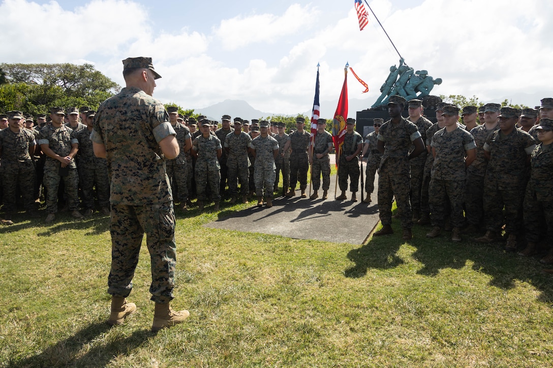 U.S Marine Corps Maj. Gen. Eric Austin, commanding general of 1st Marine Aircraft Wing (MAW), speaks to Marines with Marine Wing Support Squadron 174, Marine Aircraft Group (MAG) 24, at the Iwo Jima War Memorial, Marine Corps Base Hawaii, March 28, 2024. MAG-24 hosted Austin to engage with leadership and showcase each squadron’s operational capabilities. (U.S. Marine Corps photo by Lance Cpl. Tania Guerrero)