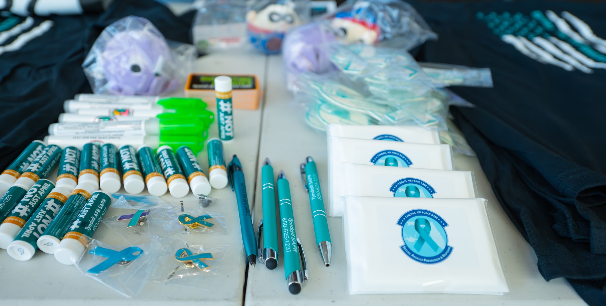 Sexual Assault Prevention Response advocates set up a booth with promotional items to show support for victims of sexual assault during the month of SAAPM.