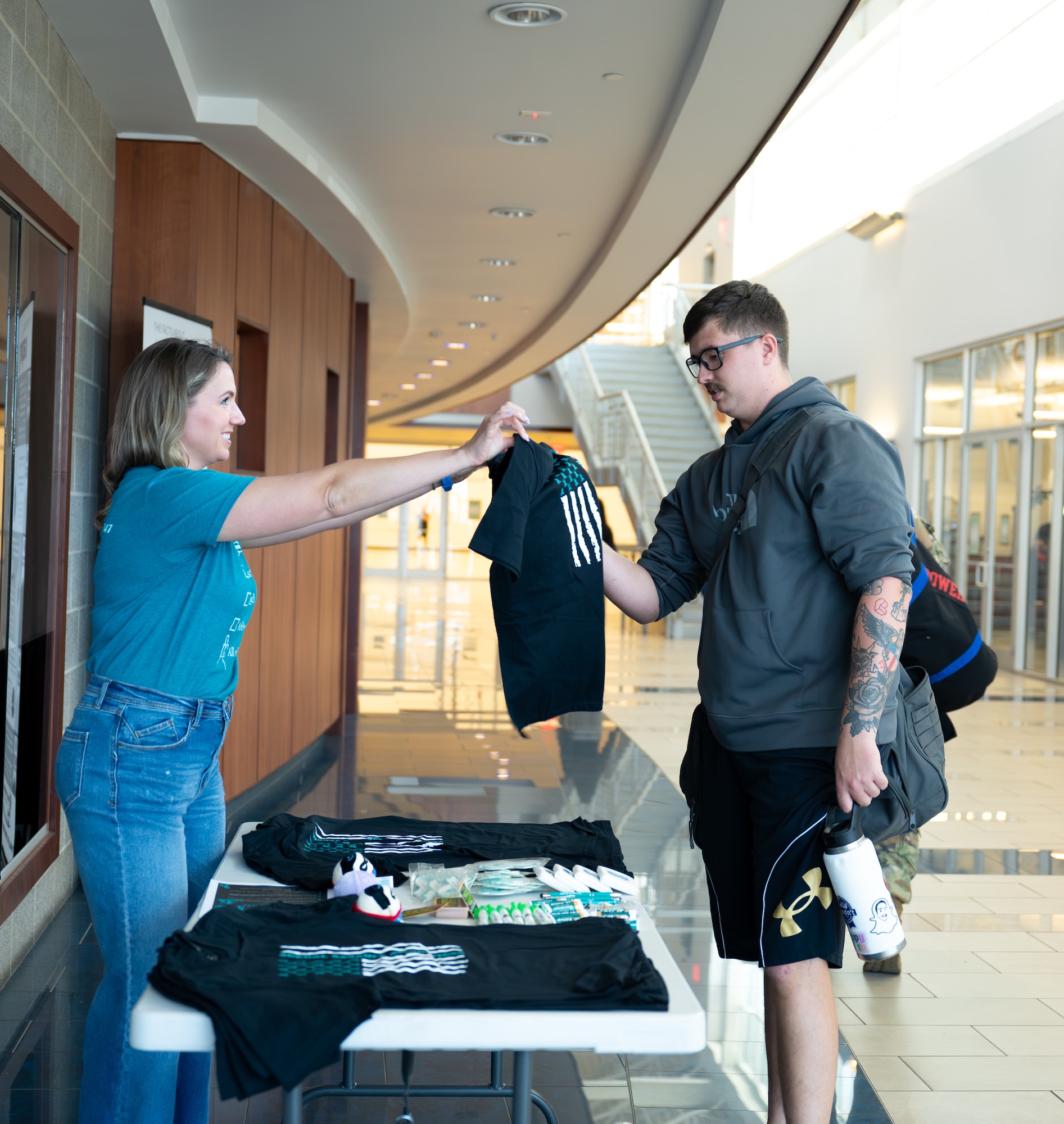 Sexual Assault Prevention Response advocates hands out free promotional items to show support for victims of sexual assault  for the month of SAAPM.