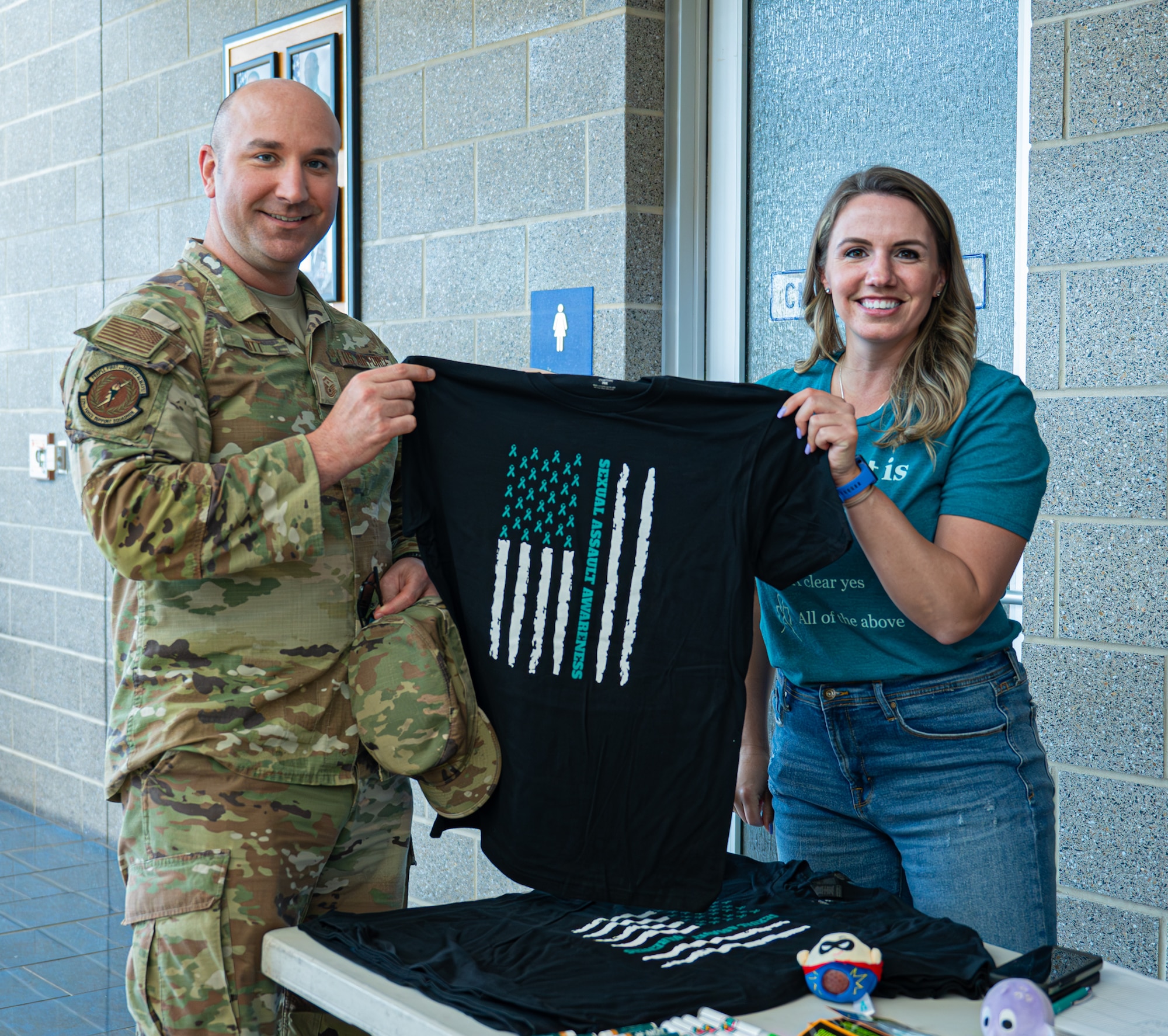 Sexual Assault Prevention Response advocates hands out free promotional items to show support for victims of sexual assault  for the month of SAAPM.