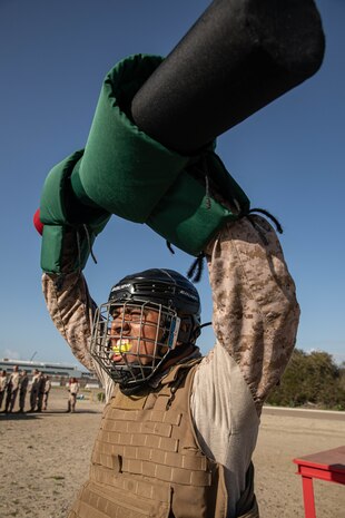 A U.S. Marine Corps recruit with Fox Company, 2nd Recruit Training Battalion, participates in a pugil sticks event at Marine Corps Recruit Depot San Diego, California, April 8, 2024. Recruits are taught Marine Corps Martial Arts Program techniques that instill basic self-defense that they will execute throughout recruit training during events like body sparring and pugil sticks to help build a warrior ethos and esprit de corps. (U.S. Marine Corps photo by Cpl. Sarah M. Grawcock)