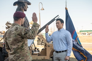 U.S. Air Force 1st Lt. Alexander Triani, a combat rescue officer at the 103rd Rescue Squadron of the 106th Rescue Wing, reads the oath of enlistment to the first Tactical Air Control Party member, Toby Ou, during a swearing-in ceremony at F.S. Gabreski Air National Guard Base (ANGB), Westhampton Beach, New York, on March 1, 2024. Ou will be assigned to the 174th Air Support Operations Squadron in Syracuse, N.Y., and will drill and participate in training with the 103rd Rescue Squadron at Gabreski ANGB, Westhampton Beach, N.Y. for the duration of his first enlistment with the 106th Rescue Wing. (U.S. Air National Guard photo by Staff Sgt. Kevin J. Donaldson)