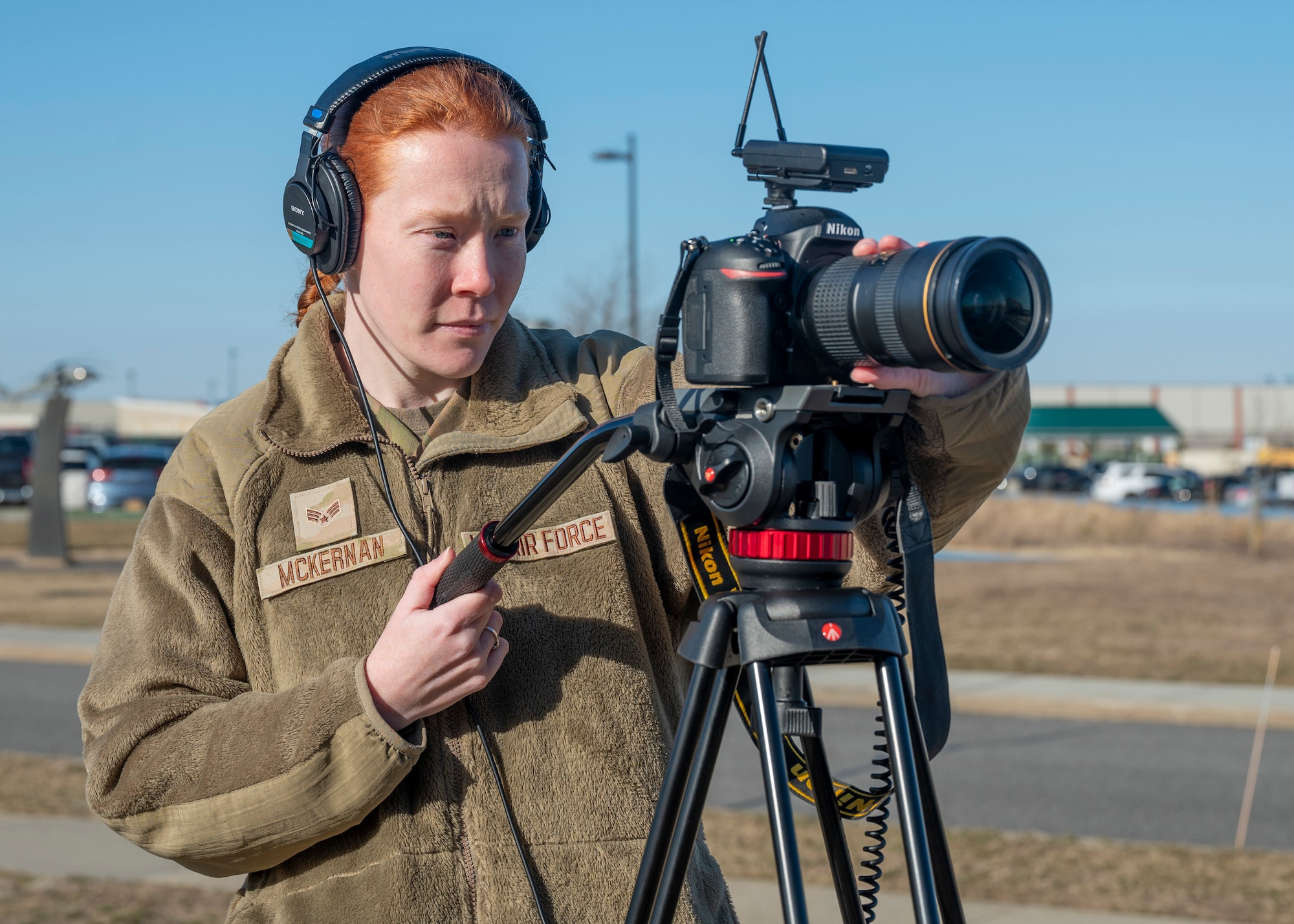 U.S. Air Force Senior Airman Sarah McKernan, a public affairs specialist of the 106th Rescue Wing, captures video footage of new enlistment swearing-in ceremony at F.S. Gabreski Air National Guard Base, Westhampton Beach, New York, March 1, 2024. McKernan was selected as the New Videographer of the Year for the Air National Guard for 2023. (U.S. Air National Guard Photo by SSgt. Kevin Donaldson)