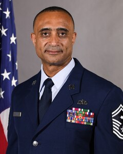 U.S. Air Force Senior Master Sgt. Roland Cooper, first sergeant assigned to the 103rd Rescue Squadron of the 106th Rescue Wing, poses for official photo at F.S. Gabreski Air National Guard Base, Westhampton Beach, New York, Jan. 18, 2024. Sgt. Cooper was selected as the top first sergeant in the New York Air National Guard and the northeast for 2023. (U.S. Air National Guard photo by Capt. Cheran A. Campbell)