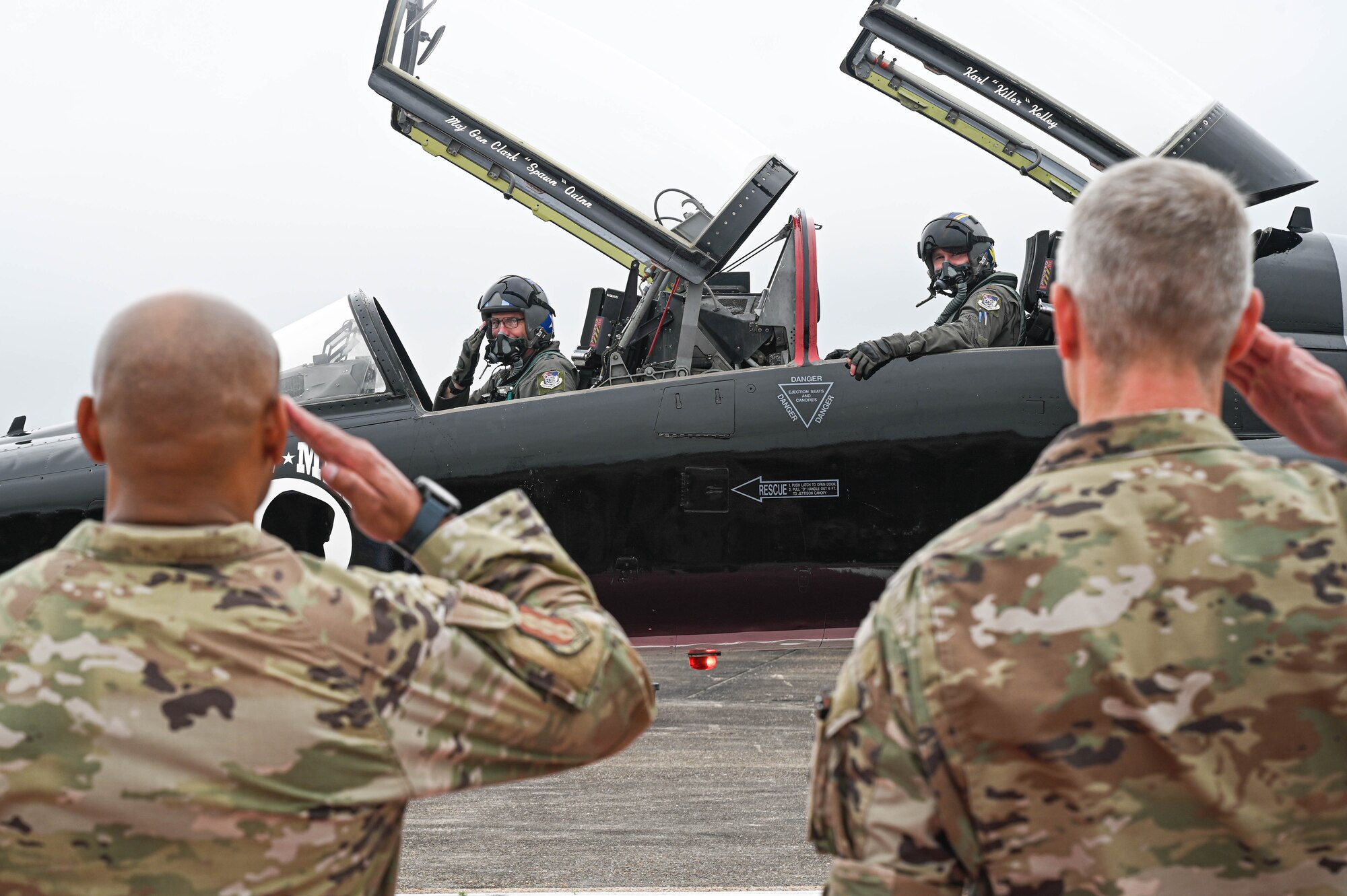 U.S. Air Force Col. Dave Skalicky, right, 33rd Fighter Wing commander, and U.S. Air Force Chief Master Sgt. Kelvin Hatcher, left, 33rd FW command chief, salute Maj. Gen. Clark Quinn, 19th Air Force commander, as he arrives at Eglin Air Force Base, Florida, April 2, 2024.