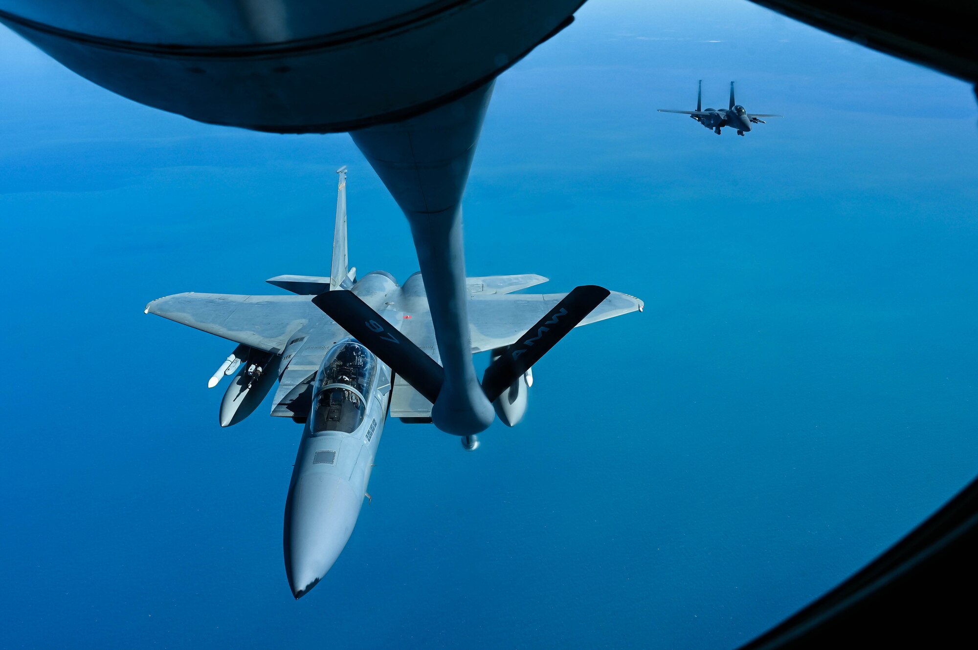 An F-15C Eagle assigned to the 53rd Wing approaches a KC-135 Stratotanker assigned to the 97th Air Mobility Wing to be refueled over the skies of Florida during a large force exercise for the 19th AF Warhammer Rally, April 04, 2024.