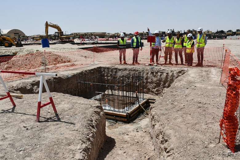 U.S. Army Col. Mohammed Z. Rahman, U.S. Army Corps of Engineers Transatlantic Expeditionary District commander (center), along with district engineers and the regional Safety chief, view an excavated area during a site visit at Camp Buehring, Kuwait, Apr. 8, to review the Tactical Equipment Maintenance Facility project, demonstrating USACE’s dedication to maintaining operational excellence and ensuring project success.