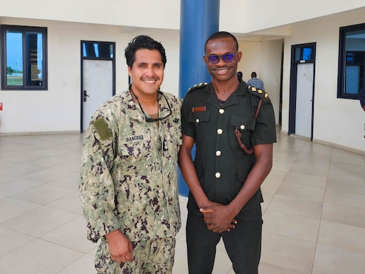 U.S. Navy Hospital Corpsman 1st Class Marcos Ramirez, assigned to Naval Mobile Construction Battalion (NMCB) 11, left, and Ghana Army Capt.  Clement Awagah, assigned to the Ghana Naval Training Command (NAVTRAC) Medical Clinic pose for a photograph onboard NAVTRAC in Nutekpor-Sogakope in the Volta Region of Ghana, Feb. 26, 2024. NMCB 11, assigned to the TWENTY SECOND Naval Construction Regiment, is forward deployed across the U.S. Naval Forces Europe-Africa area of operations, in support of U.S. Sixth Fleet maritime operations to defend U.S., allied, and partner interests. (Courtesy Photo)