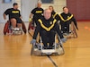 CW3 Kirk Holden is taking morning laps on day one of wheelchair rugby camp.