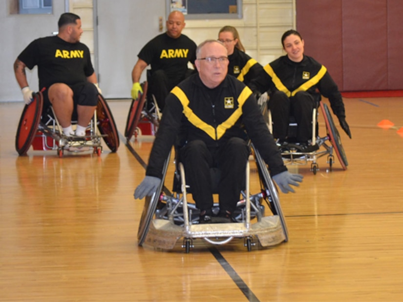 CW3 Kirk Holden is taking morning laps on day one of wheelchair rugby camp.