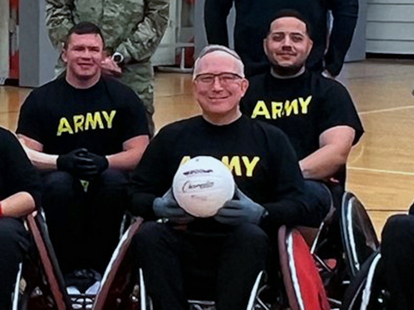 CW3 Kirk Holden pose for photo while practicing for wheelchair rugby