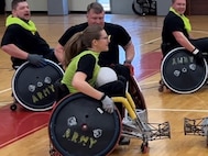 Spc. Brooke Jader sets up the hit in wheelchair rugby.