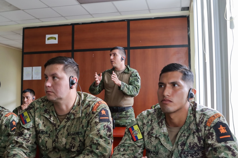 An Ecuadorian Army soldier speaks with members of the Kentucky Army National Guard during a classroom discussion on urban operations in Latacunga, Ecuador, March 18, 2024