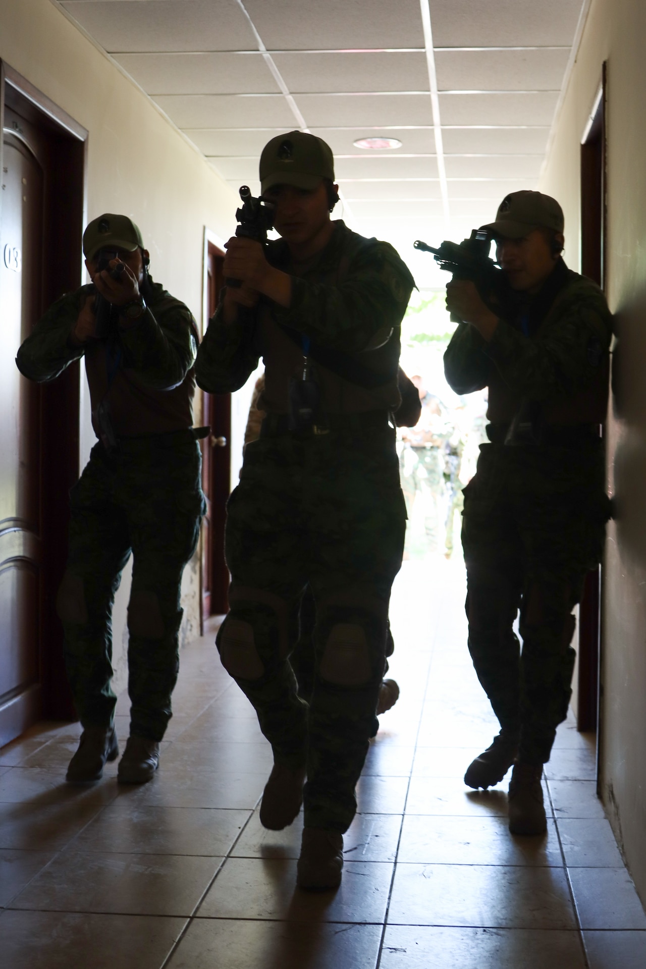 Four members of the Ecuador Army demonstrate urban operations in Latacunga, Ecuador, March 21, 2024.