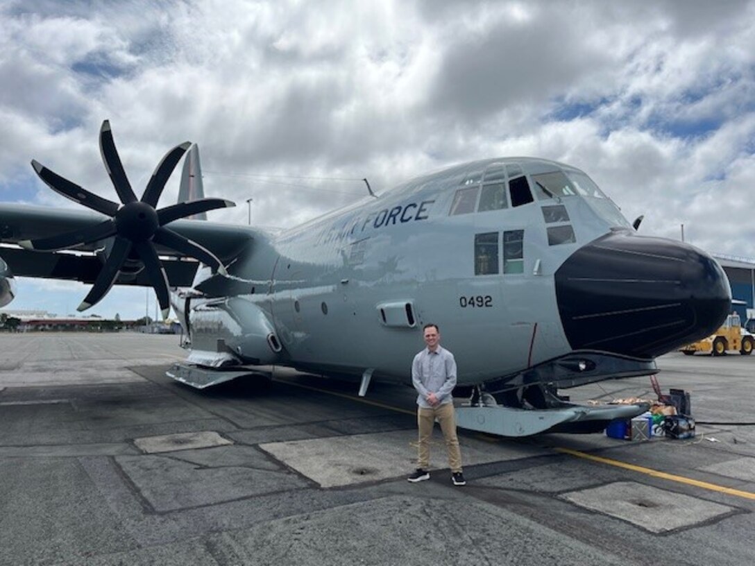 ENS Jonathan Myette in front of LC-130.