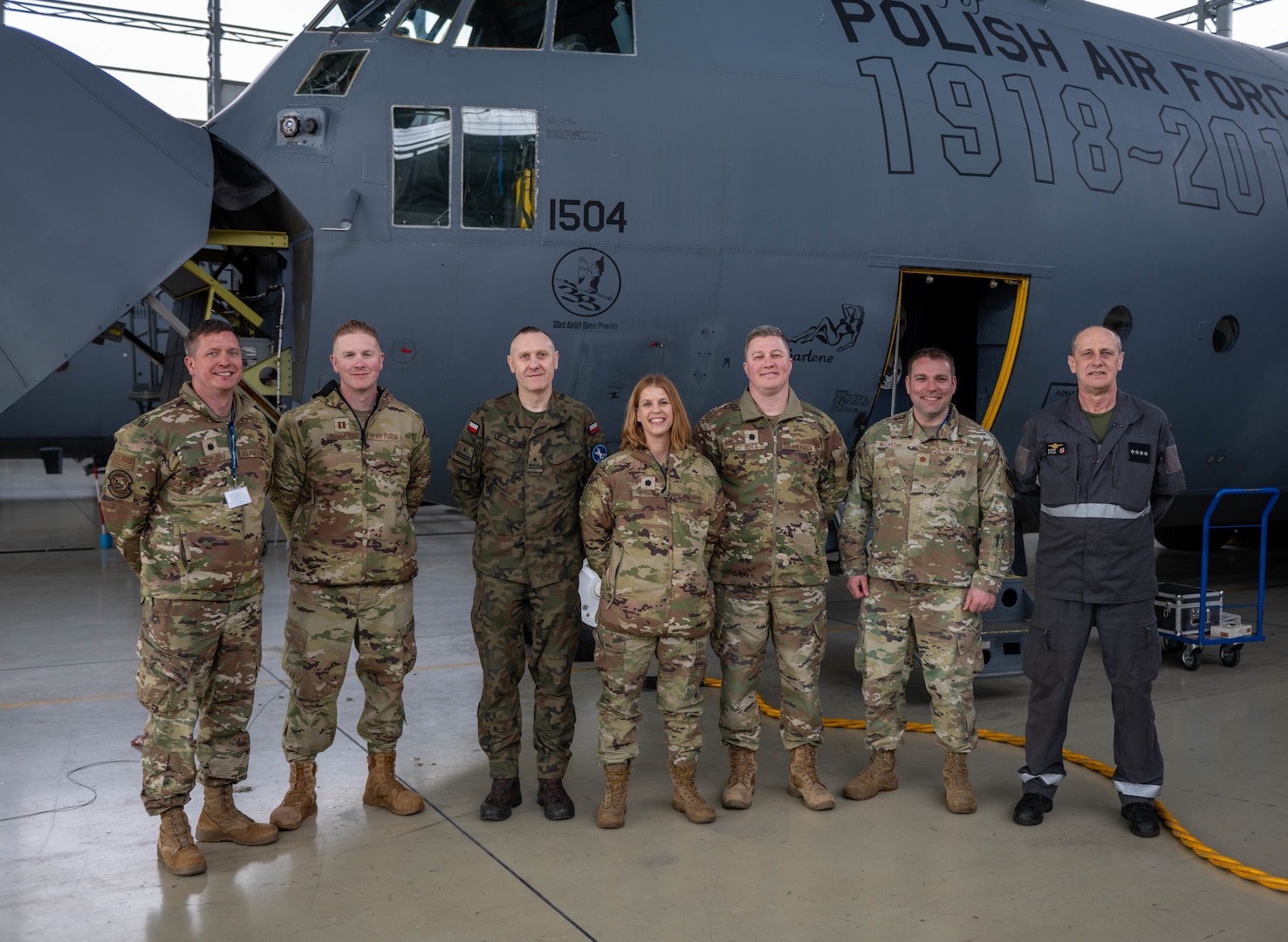Members of the 126th Air Refueling Wing stand with Polish Air Force counterparts after touring the 33rd Air Base maintenance facility March 25, 2024, in Powidz, Poland. The Illinois Air National Guard wing visited Poland as a part of the State  Partnership Program.