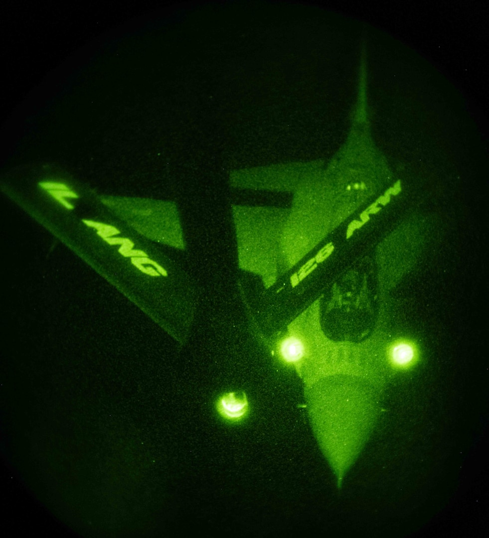 A Polish F-16 approaches the boom of a KC-135 Statotanker during a nighttime refuel with the 126th Air Refueling Wing over Powidz, Poland, March 27, 2024.