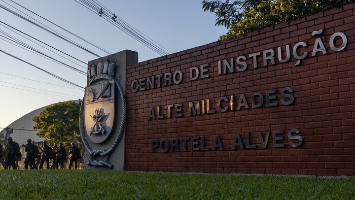 Corpo de Fuzileiros Navais (Brazilian Marine Corps) return from a hike during basic training at Centro de Instrução Almirante Milcíades Portela Alves, Brazil, on April 4, 2024. Leaders from Marine Forces, South and Marine Corps Recruit Depot San Diego visited their Fuzileiros Navais counterparts for a Recruit Training Subject Matter Expert Exchange, which aims to enhance the training frameworks and leadership skills necessary for the successful integration of female recruits into the Brazilian Marine Corps. Additionally, the exchange fosters a bilateral partnership, enabling both nations to share best practices and innovations in military training and operational readiness. (U.S. Marine Corps photo by Lance Cpl. David Intriago)