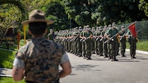 U.S. Marine Corps Master Sgt. Anggie Acosta, a chief instructor at Drill Instructor School, Recruit Training Regiment, Marine Corps Recruit Depot San Diego, observes Corpo de Fuzileiros Navais (Brazilian Marine Corps) recruits drill during a Recruit Training Subject Matter Expert Exchange at Centro de Instrução Almirante Milcíades Portela Alves, Brazil, on April 4, 2024. The SMEE aims to enhance the training frameworks and leadership skills necessary for the successful integration of female recruits into the Brazilian Marine Corps. Leaders from Marine Corps Recruit Depot San Diego visited their Fuzileiros Navais counterparts to share best practices and lessons learned from U.S. Marine Corps recruit training integration. (U.S. Marine Corps photo by Lance Cpl. David Intriago)