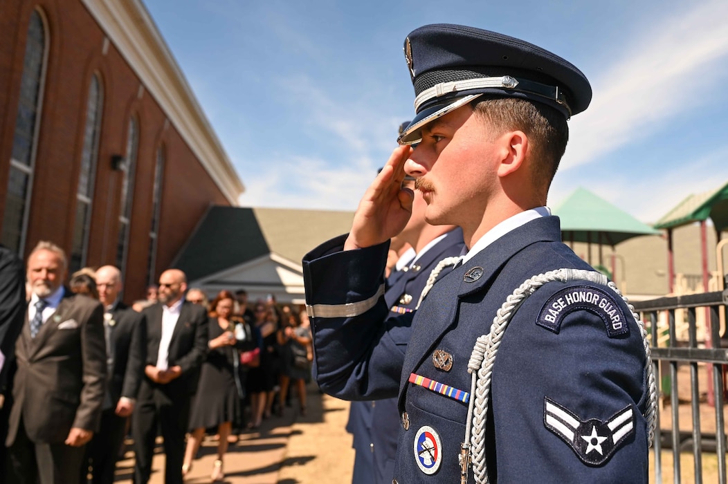 U.S. Air Force Airman 1st Class Lain Baker, Altus Air Force Base Blue Knights Honor Guardsman, salutes Astronaut Thomas Stafford’s casket as it leaves First Baptist Church of Weatherford in Weatherford, Oklahoma, April 5, 2024.The Blue Knights served as pallbearers, administered flag folding duties and performed a 21 gun salute during Stafford’s service. (U.S. Air Force photo by Airman 1st Class Kari Degraffenreed)