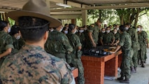 U.S. Marine Corps Master Sgt. Anggie Acosta, a chief instructor with Drill Instructor School, Recruit Training Regiment, Marine Corps Recruit Depot San Diego, observes as Corpo de Fuzileiros Navais (Brazilian Marine Corps) recruits attend a weapon maintenance class during basic training at Centro de Instrução Almirante Milcíades Portela Alves, Brazil, on April 4, 2024. Leaders from Marine Forces, South and Marine Corps Recruit Depot San Diego visited their Fuzileiros Navais counterparts for a Recruit Training Subject Matter Expert Exchange to exchange best practices and lessons learned from U.S. Marine Corps recruit training integration. The SMEE aims to enhance the training frameworks and leadership skills necessary for the successful integration of female recruits into the Brazilian Marine Corps. Additionally, the exchange fosters a bilateral partnership, enabling both nations to share best practices and innovations in military training and operational readiness. (U.S. Marine Corps photo by Lance Cpl. David Intriago)