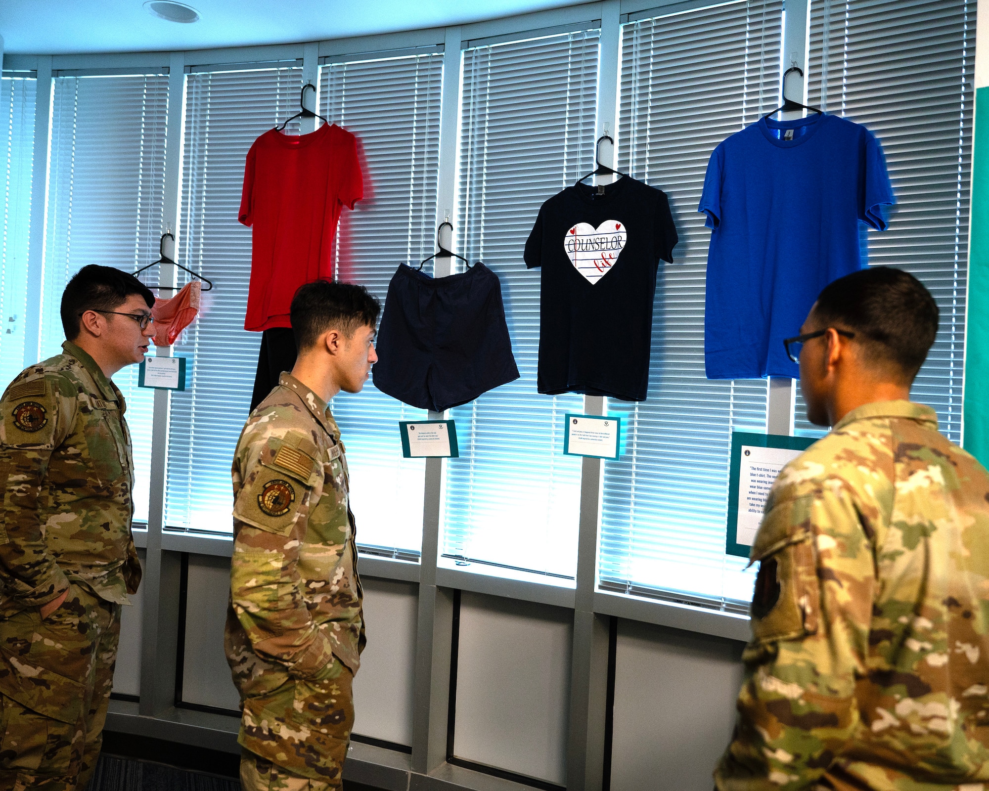 Airmen from the 70th Intelligence, Surveillance and Reconnaissance Wing, observe displays during a “What were you wearing,” event, April 10, 2024, at Fort George G. Meade, Maryland. The event aims to combat victim blaming related to clothing worn during sexual assault and harassment incidents. (U.S. Air Force photo by Tech. Sgt. Kevin Iinuma)