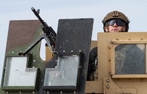 Airman 1st Class Alek Natkowski, 5th Security Forces Squadron defender, provides overwatch security from a Humvee during Prairie Vigilance 24-3 at Minot Air Force Base, North Dakota, April 7, 2024. Exercises like Prairie Vigilance demonstrate the capability, resilience, adaptability, and strength of Team Minot Airmen. (U.S. Air Force photo by Airman 1st Class Kyle Wilson)