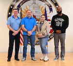 From left, Mr. Joseph Althoff, Integrated Primary Prevention Manager; Mr. Jason Dickson, DCANG Prevention Coordinator, Ms. Juliann Bryant, DCANG Prevention Analyst, and Mr. Karlus Madison, DCARNG Prevention Analyst, stand for a photograph following a meeting at Joint Base Andrews, April 5, 2024. The District of Columbia National Guard's Integrated Resilience Operations (IRO) program equips the organization with the knowledge, skills, tools and resources required to continually assess and adjust mitigation plans for unit commanders and senior leaders of the D.C. National Guard geared toward identifying where the organization succeeds and where there's challenges. (U.S. Air National Guard photo by Senior Master Sgt. Craig Clapper)