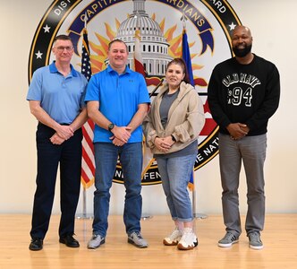 From left, Mr. Joseph Althoff, Integrated Primary Prevention Manager; Mr. Jason Dickson, DCANG Prevention Coordinator, Ms. Juliann Bryant, DCANG Prevention Analyst, and Mr. Karlus Madison, DCARNG Prevention Analyst, stand for a photograph following a meeting at Joint Base Andrews, April 5, 2024. The District of Columbia National Guard's Integrated Resilience Operations (IRO) program equips the organization with the knowledge, skills, tools and resources required to continually assess and adjust mitigation plans for unit commanders and senior leaders of the D.C. National Guard geared toward identifying where the organization succeeds and where there's challenges.