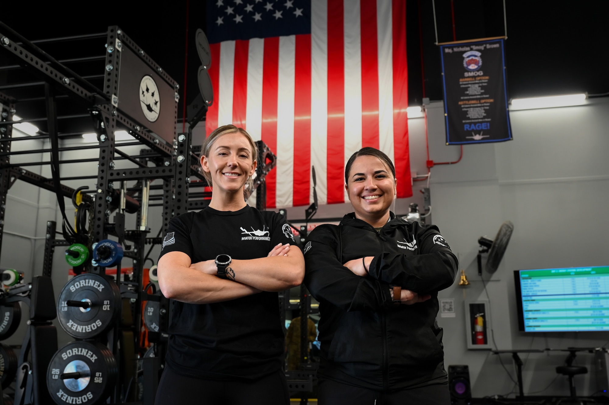 U.S. Air Force Maj. Laney Schol, an F-35A Lightning II instructor pilot assigned to the 60th Fighter Squadron, left, and Maj. Stephanie Chayrez, the 33rd Fighter Wing Aircrew Performance team program director, pose for a photo at the Aircrew Performance Center at Eglin Air Force Base, Florida, March 27, 2024.