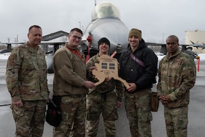 Airmen assigned to the 18th Fighter Generation Squadron pose for a photo after winning the quarterly load competition at Eielson Air Force Base, Alaska, April 5, 2024.
