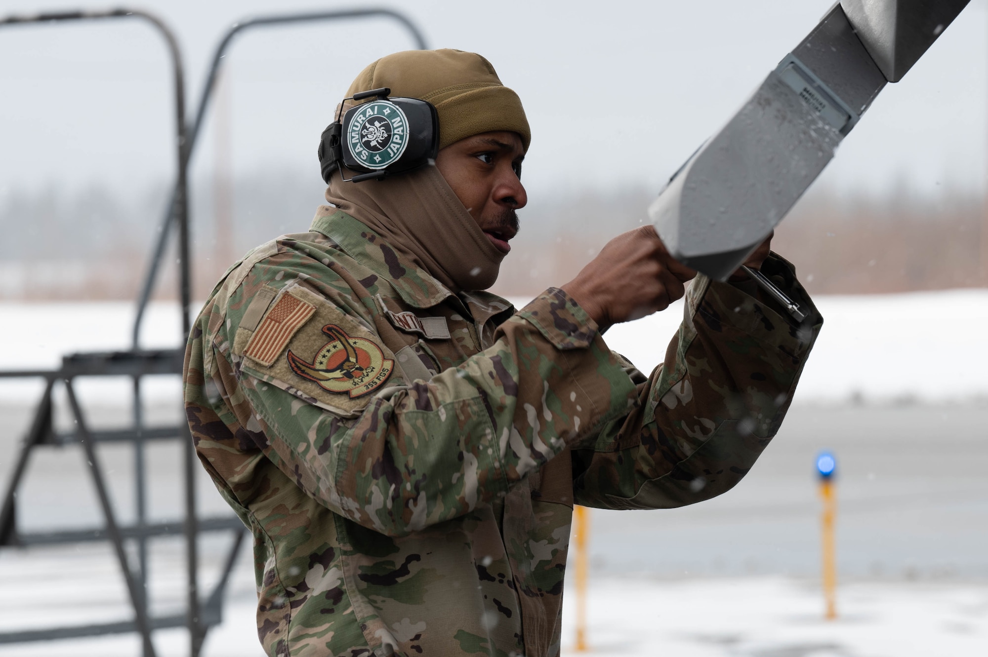 U.S. Air Force Senior Airman Felix Fenton, 355th Fighter Generation Squadron load crew team member, prepares a fighter jet for munitions during a load competition at Eielson Air Force Base, Alaska, April 5, 2024.