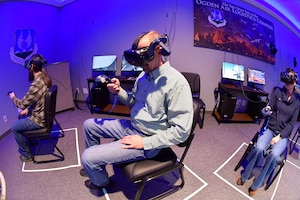 John Sowder, Chief of Maintenance Training Instruction, demonstrates the Ogden Air Logistics Complex Training Branch’s virtual reality training program in a state-of-the-art immersive classroom Feb. 12, 2024, at Hill Air Force Base, Utah. This innovative program within the Ogden ALC caters to both new hires and veteran workforce. (U.S. Air Force photo by Todd Cromar)