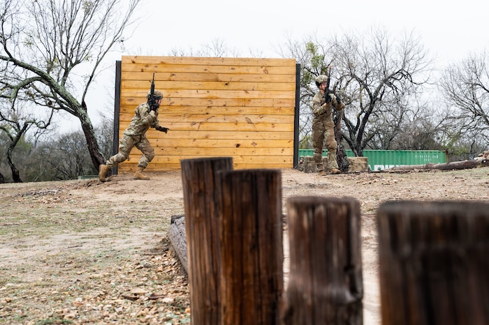 A Security Forces Technical Training student runs during training at Joint Base San Antoino-Chapman Annex, Texas, Jan. 22, 2024. The 343rd Training Squadron is optimizing training to ensure Defenders are equipped with the skills and knowledge needed to tackle evolving threats in a modern era. The 343 TRS Security Forces technical training is one of the key components in the Defender Next initiative, where the career field is undertaking the largest shift in the schoolhouse in over two decades.  (U.S. Air Force photo by Vanessa R. Adame)