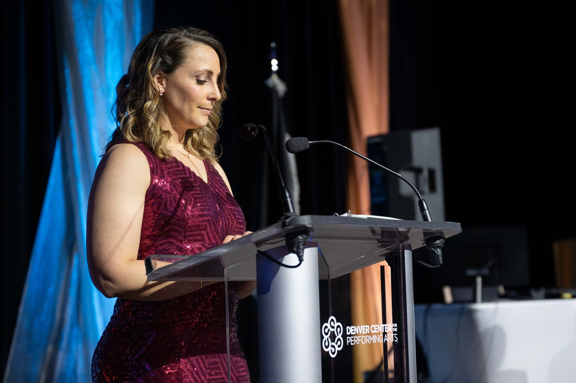 U.S. Air Force Tech. Sgt. Brittany Shirley, 460th Contracting, commodities section chief, presents as a master of ceremonies, at the Buckley Ball at the Denver Center for the Performing Arts, Denver, Colorado, April 6, 2024. The Buckley Ball was the first event of its kind at Buckley Space Force Base, to include total force personnel from all branches, marking a historic occasion. (U.S. Space Force photo by Airman 1st Class Joshua Hollis)