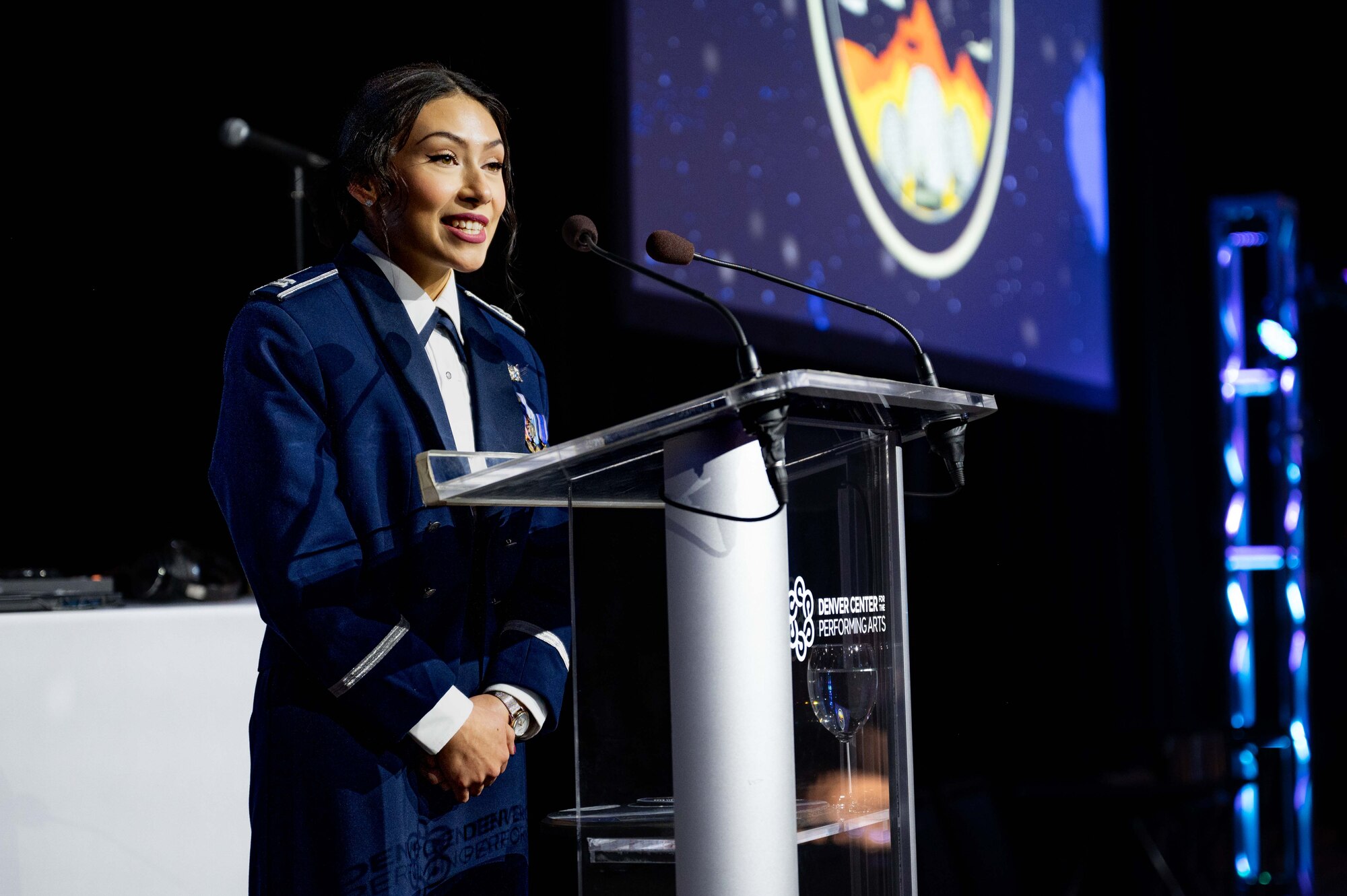 U.S. Space Force Capt. Vannessa Garcia Espinoza, Detachment 2 Mission Management Officer instructor, presents as a master of ceremonies, at the Buckley Ball at the Denver Center for the Performing Arts, Denver, Colorado, April 6, 2024. The Buckley Ball was the first event of its kind at Buckley Space Force Base, to include total force personnel from all branches, marking a historic occasion. (U.S. Space Force photo by Airman 1st Class Joshua Hollis)