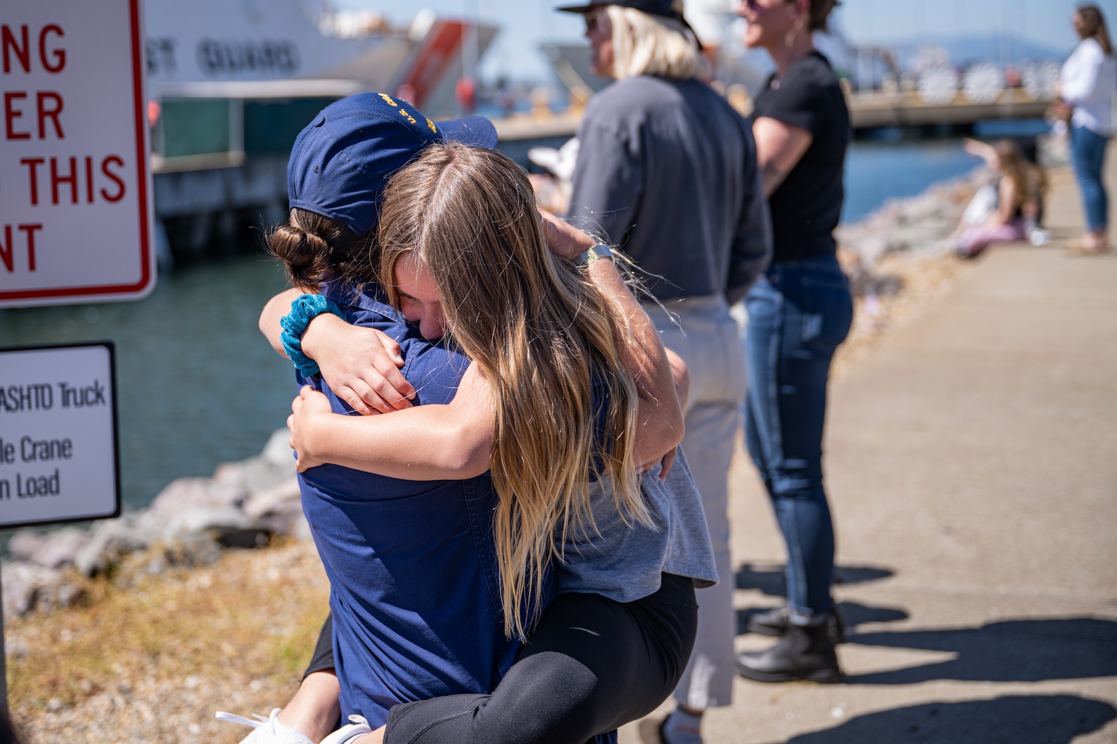 U.S. Coast Guard Commander Leah Cole, the Executive Officer of the Coast Guard Cutter Bertholf (WMSL 750) greets her family at the cutter's return to home port on Coast Guard Base Alameda, Calif., following a 98-day patrol in the Indo-Pacific region, April 8, 2024. The U.S. Coast Guard has operated in the Indo-Pacific for more than 150 years, and the Service is increasing efforts through targeted patrols with our National Security Cutters, Fast Response Cutters, and other activities conducted in support of Coast Guard missions to enhance our partnerships. (U.S. Coast Guard Photo by Petty Officer 3rd Class Hunter Schnabel)